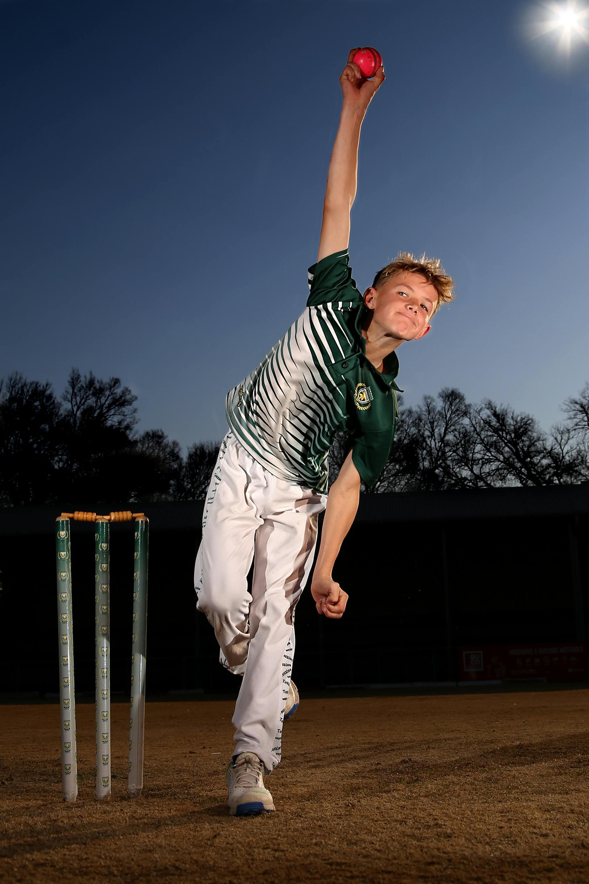 Bowler in delivery stride during match
