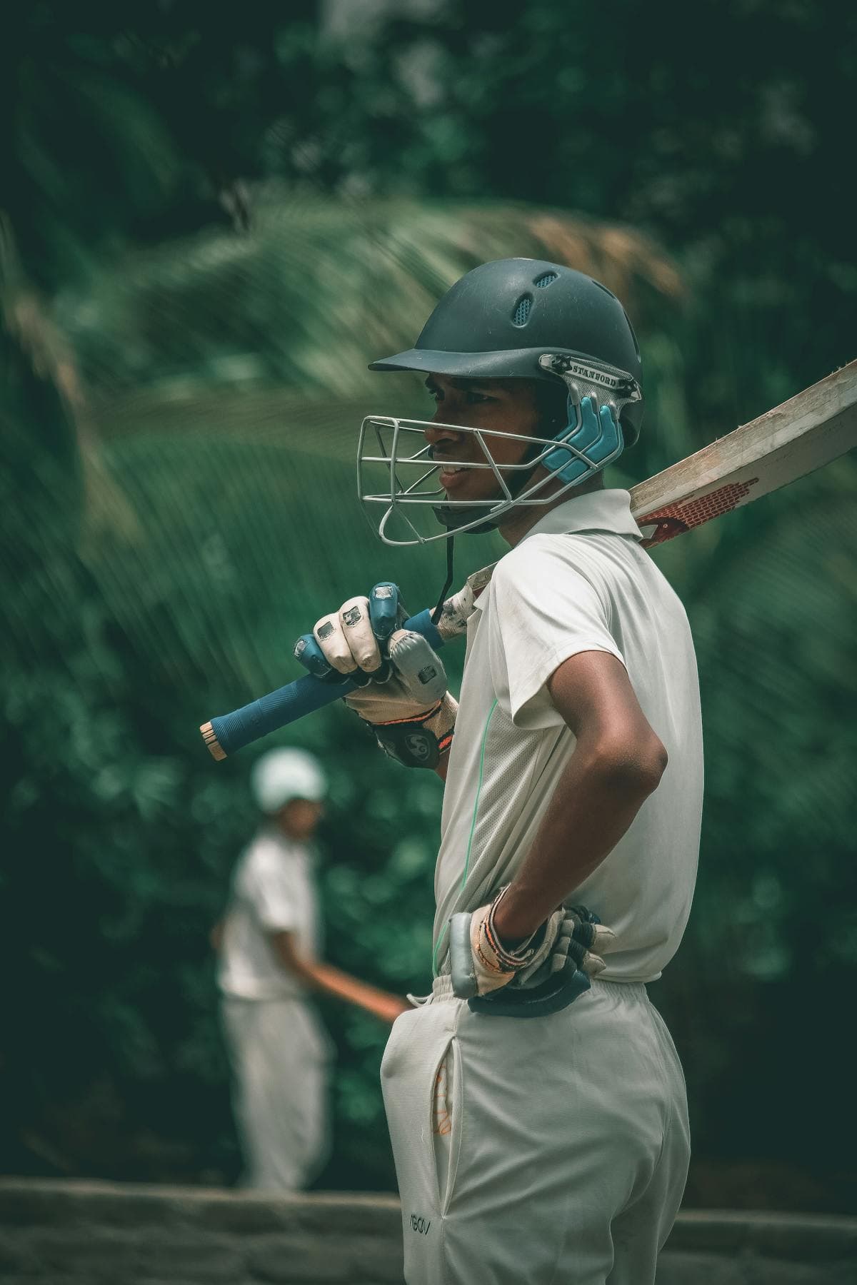Young player practising batting stance